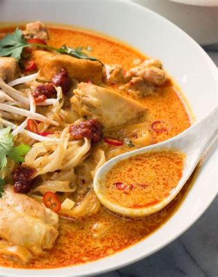 Laksa Johor: A Creamy Coconut Broth Symphony Intertwined With Spicy Seafood Delights!