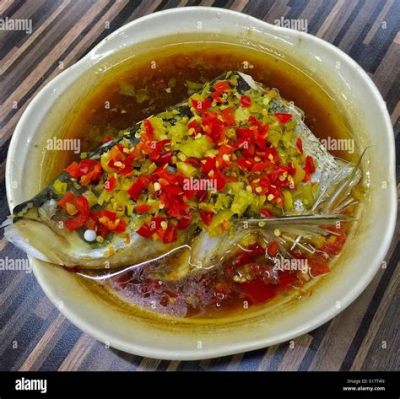 Spicy Steamed Fish Head with Pickled Vegetables! An Exquisite Symphony of Savory and Tangy Flavors